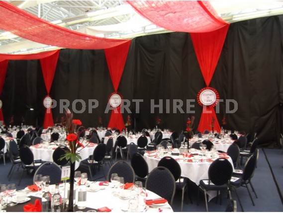 Velvet drapes in red with rosettes